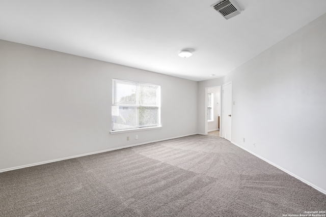 unfurnished room featuring carpet floors