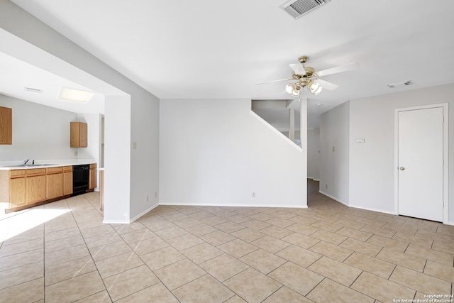 unfurnished living room with wine cooler, ceiling fan, and sink