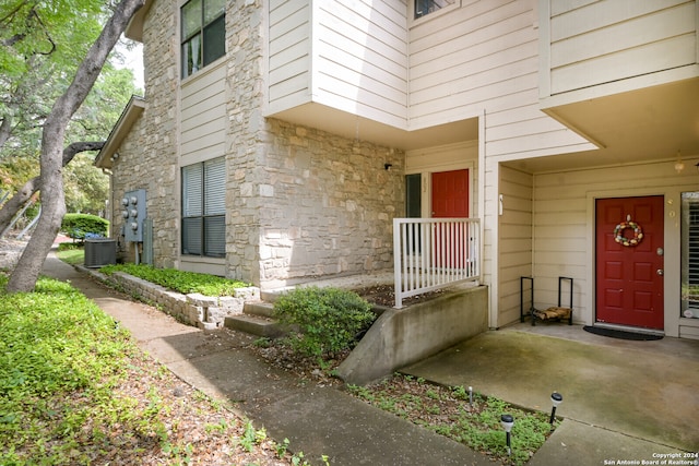 entrance to property featuring central air condition unit