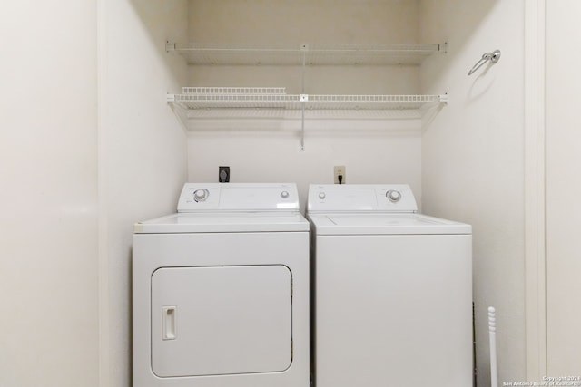 laundry room with separate washer and dryer