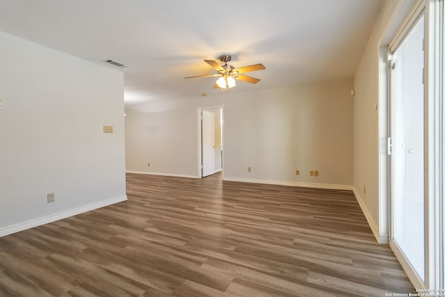 empty room with ceiling fan and wood-type flooring