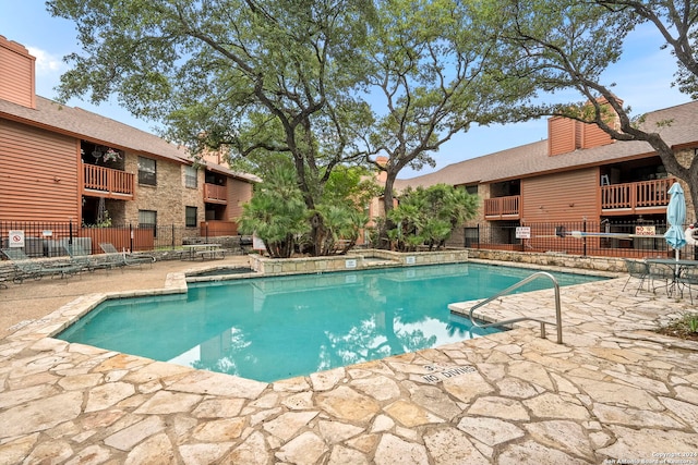 view of pool featuring a patio