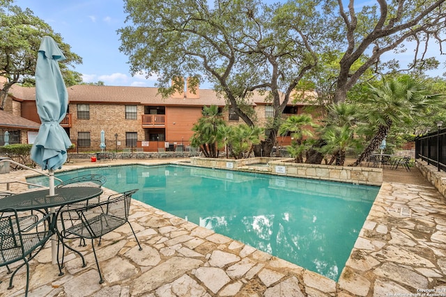 view of swimming pool featuring a patio