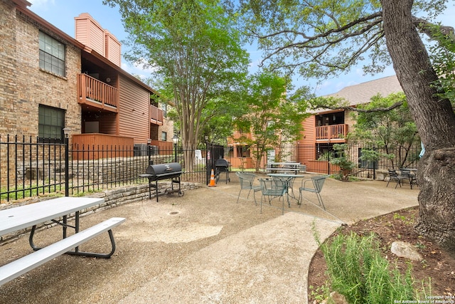 view of property's community featuring a patio area