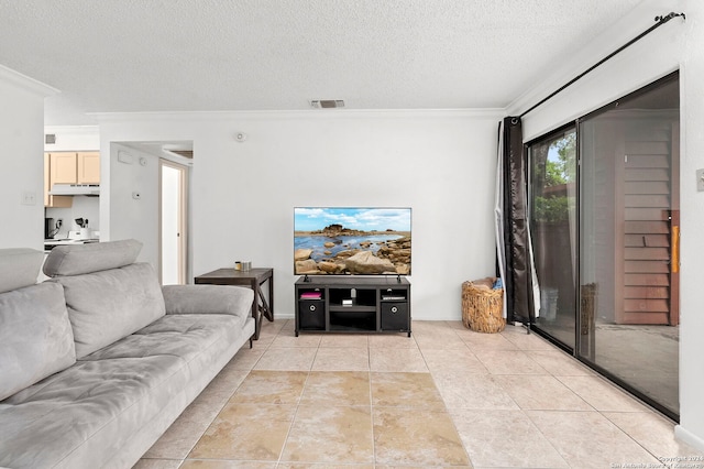 tiled living room featuring a textured ceiling and ornamental molding