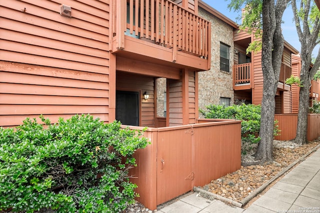 entrance to property with a balcony