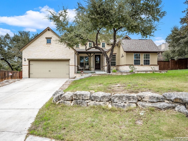 view of front of house featuring a garage and a front lawn