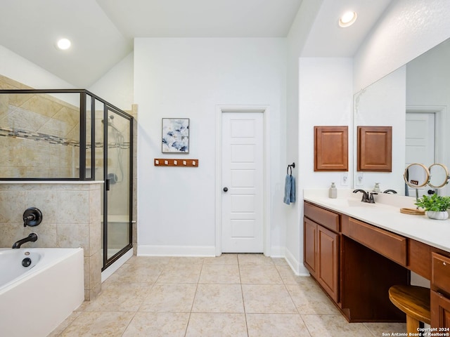 bathroom with tile patterned floors, vanity, lofted ceiling, and independent shower and bath