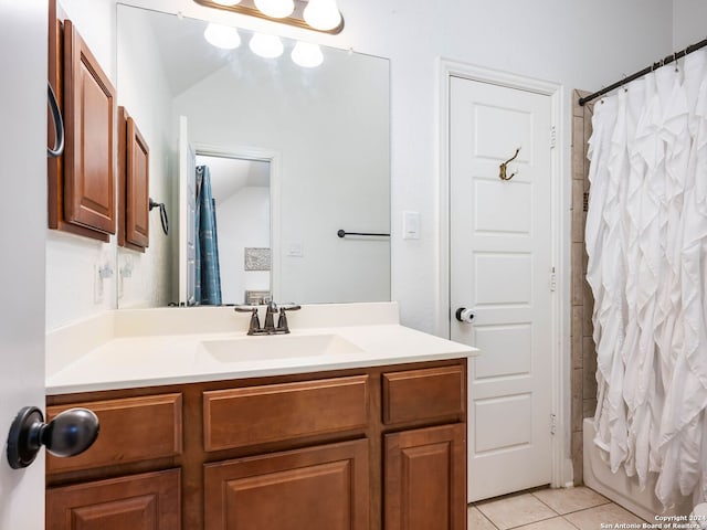 bathroom featuring tile patterned flooring, vanity, lofted ceiling, and shower / tub combo with curtain