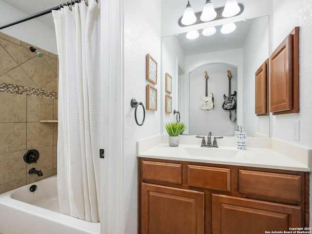 bathroom with shower / bath combination with curtain and vanity