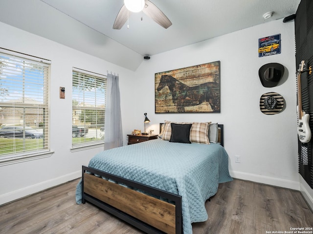 bedroom with ceiling fan and hardwood / wood-style floors