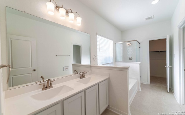 bathroom featuring vanity, tile patterned flooring, and plus walk in shower