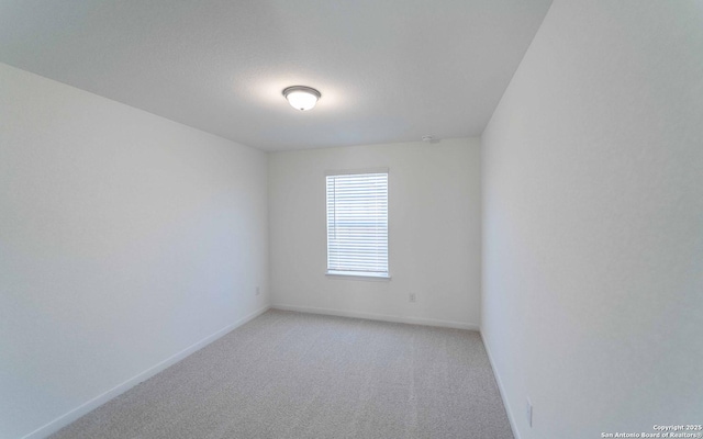 spare room featuring carpet floors