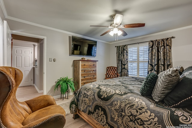 bedroom with ceiling fan, crown molding, and light hardwood / wood-style flooring