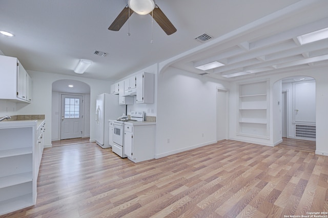 kitchen with light hardwood / wood-style flooring, white cabinets, and white appliances