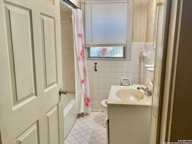 full bathroom with shower / bath combo, tile patterned flooring, toilet, vanity, and tile walls