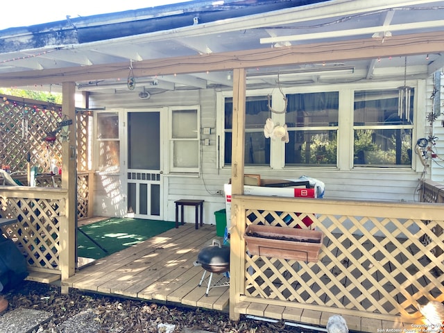 wooden terrace featuring a sunroom