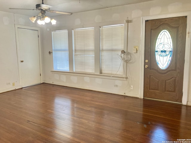 entryway with ceiling fan and dark hardwood / wood-style flooring