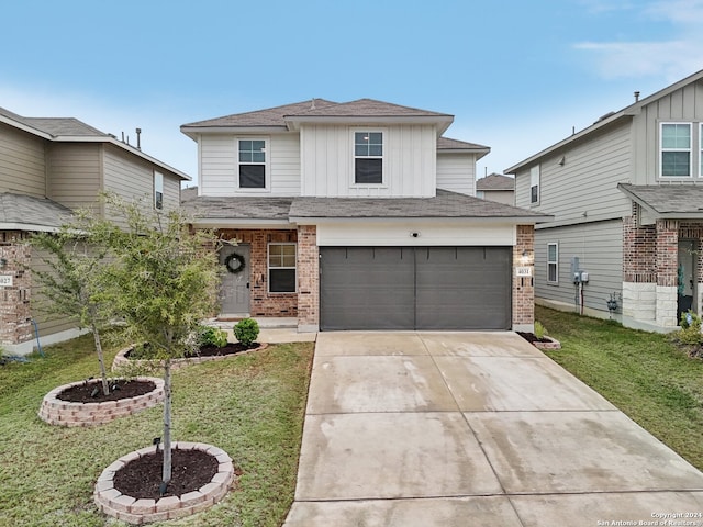 front facade featuring a front yard and a garage