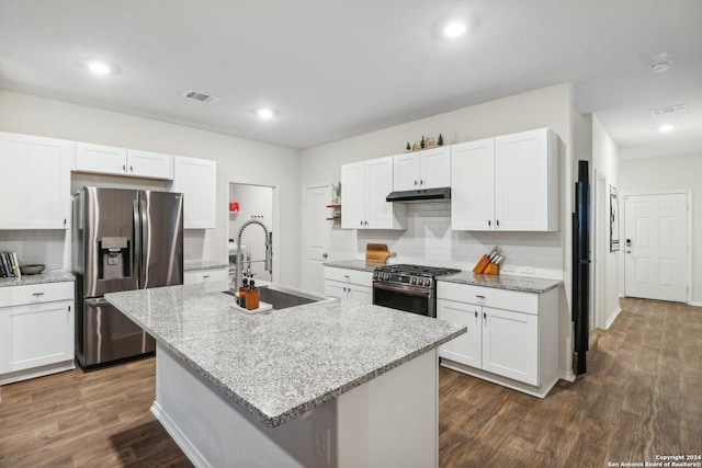 kitchen featuring a center island with sink, sink, dark hardwood / wood-style floors, white cabinetry, and stainless steel appliances