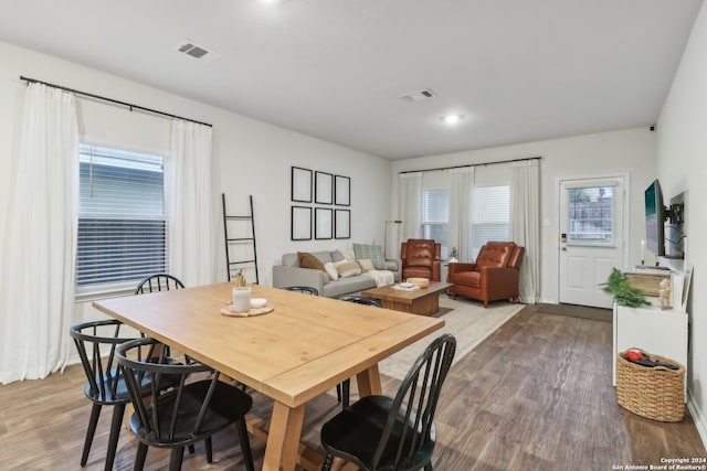 dining area with hardwood / wood-style floors