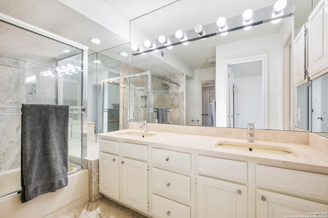 bathroom with vanity and bath / shower combo with glass door