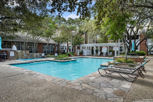 view of swimming pool featuring a patio area