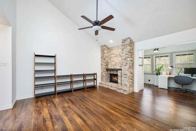 unfurnished living room featuring ceiling fan, a brick fireplace, high vaulted ceiling, dark hardwood / wood-style floors, and a textured ceiling