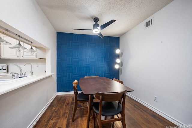 dining room featuring a textured ceiling, tile walls, ceiling fan, and dark hardwood / wood-style floors