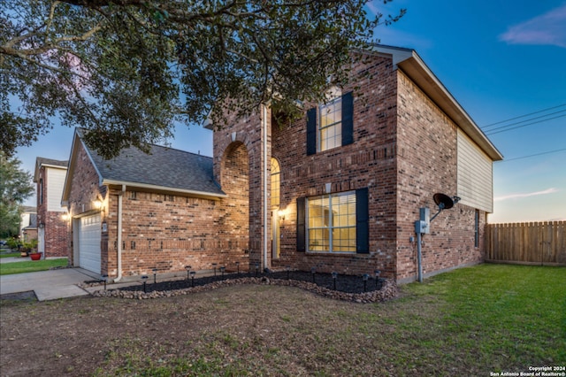 exterior space featuring a yard and a garage