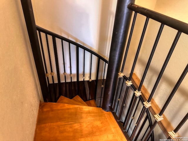 stairway featuring hardwood / wood-style floors