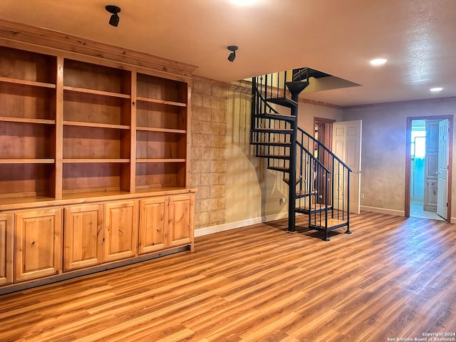 unfurnished living room featuring hardwood / wood-style flooring