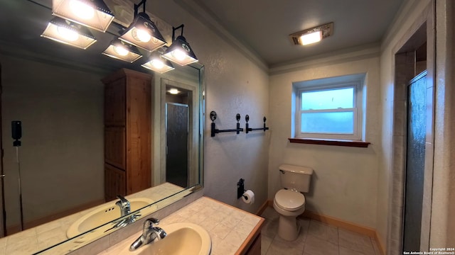 bathroom with tile patterned floors, ornamental molding, vanity, a shower with door, and toilet