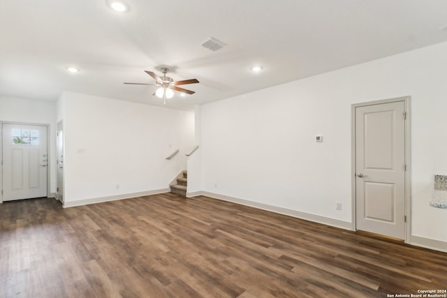 interior space with ceiling fan and dark wood-type flooring