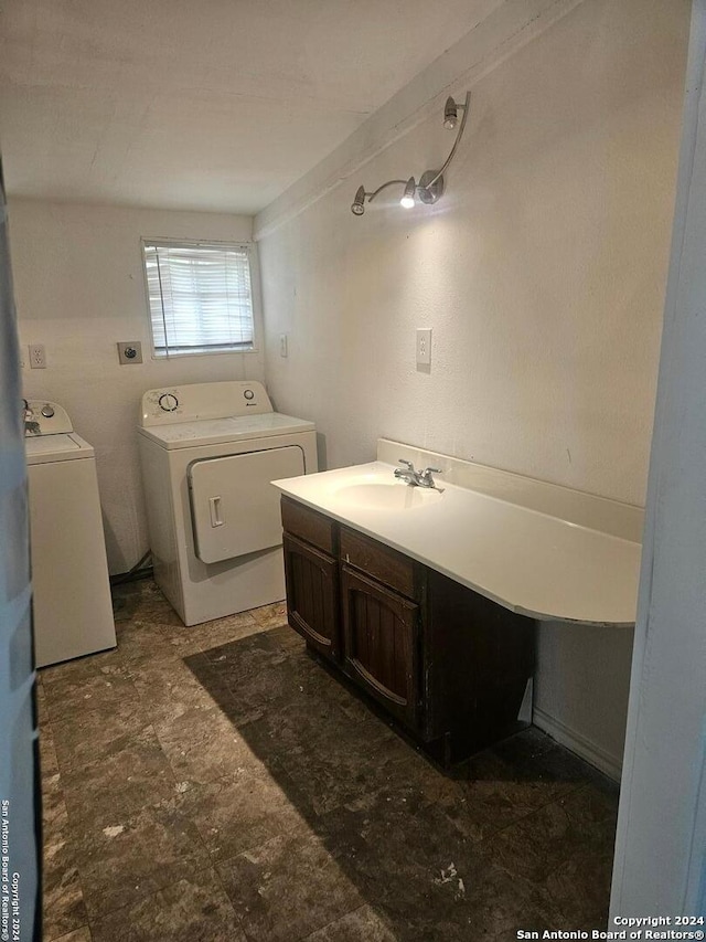 bathroom with washer and clothes dryer and vanity