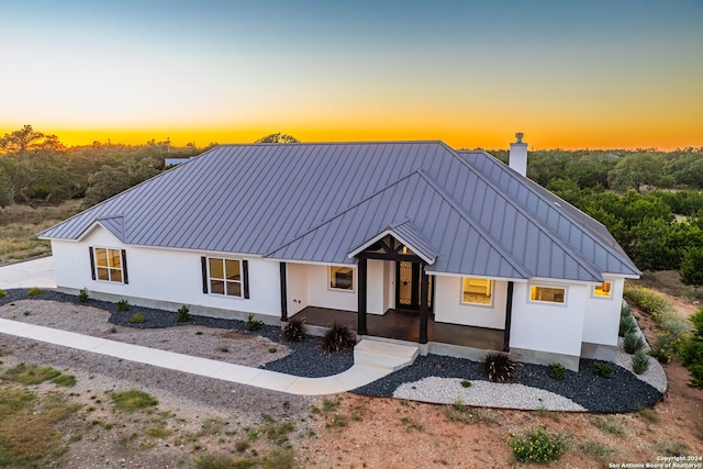 modern farmhouse style home with a porch