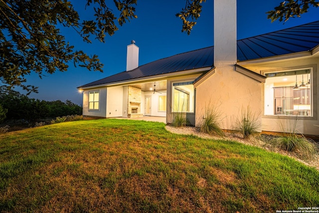 rear view of house with a lawn