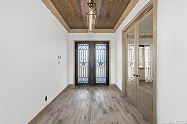 entryway featuring wood-type flooring, wooden ceiling, and french doors