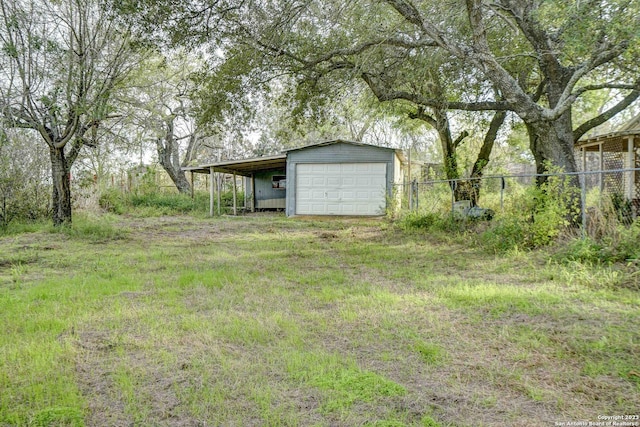 17770 Interstate 35, Lytle, TX 78052 - view of yard featuring a detached garage, an outdoor structure, and driveway