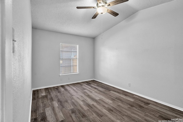 spare room with hardwood / wood-style floors, a textured ceiling, vaulted ceiling, and ceiling fan