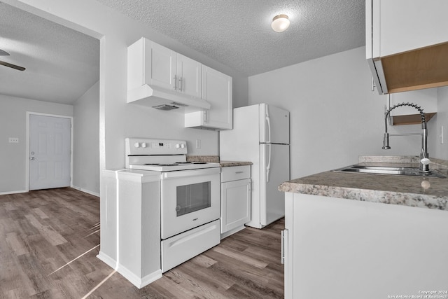 kitchen featuring white cabinets, white appliances, sink, and hardwood / wood-style floors