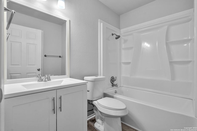 full bathroom with vanity,  shower combination, and toilet