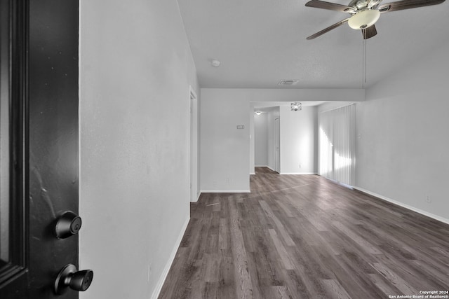 unfurnished living room with ceiling fan and wood-type flooring