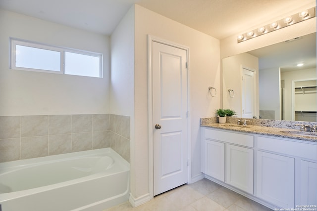 bathroom with vanity and a bathtub