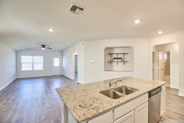 kitchen with a kitchen island with sink, sink, light hardwood / wood-style flooring, dishwasher, and white cabinets