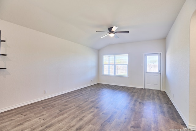 unfurnished room featuring ceiling fan, dark wood-type flooring, and vaulted ceiling