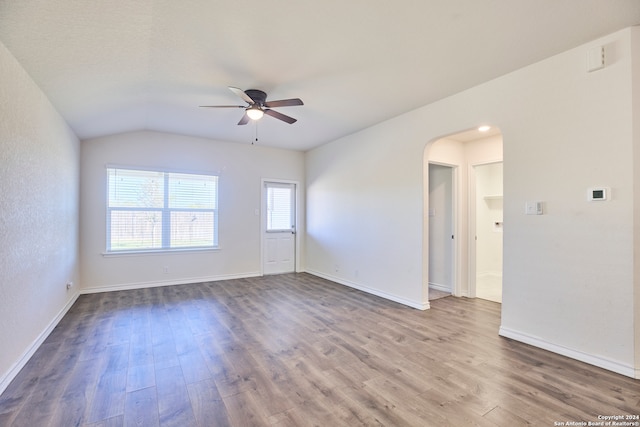 unfurnished room featuring hardwood / wood-style floors, ceiling fan, and lofted ceiling