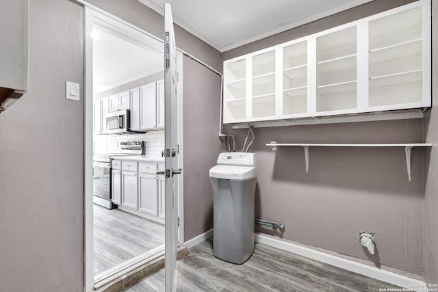 bathroom featuring decorative backsplash and hardwood / wood-style flooring