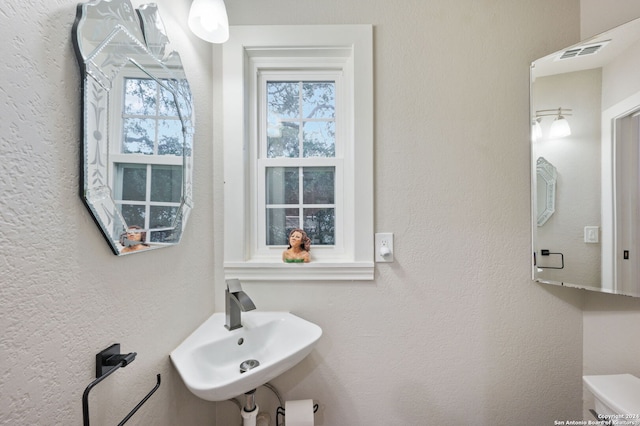 bathroom with sink and toilet