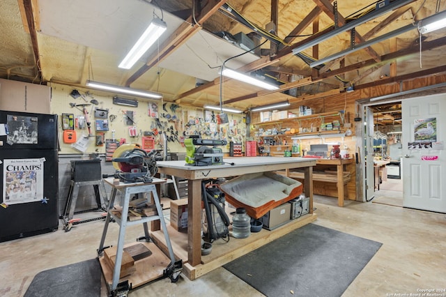 misc room with a workshop area and vaulted ceiling